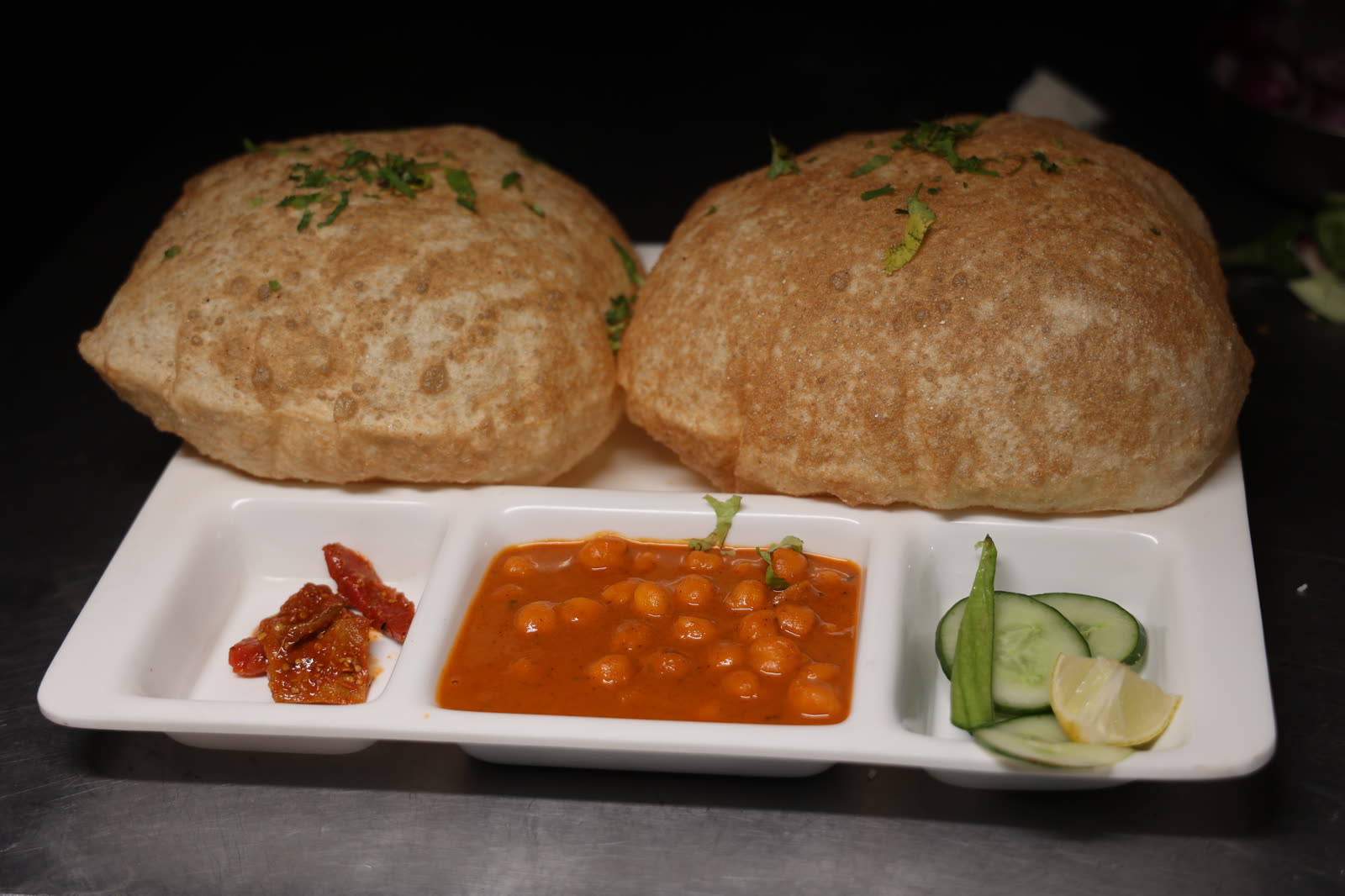 Chola Bhatura with two fried bread and chickpea curry