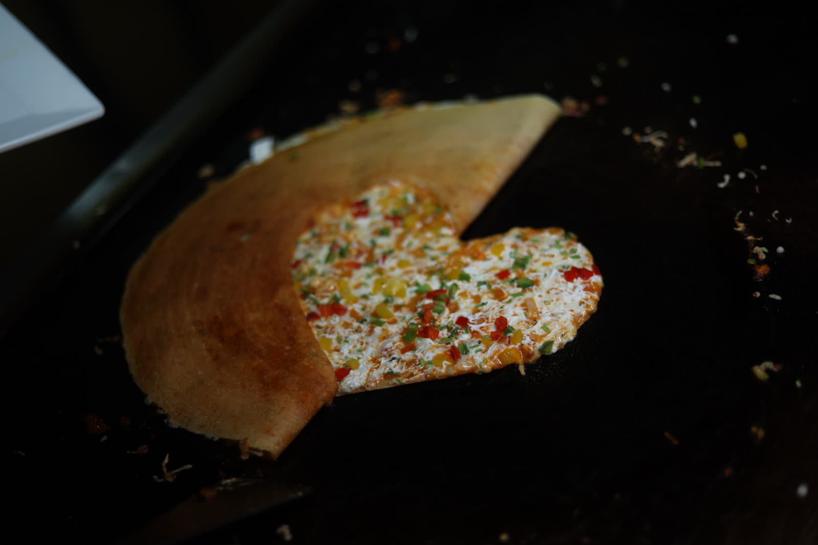 Close-up of the heart-shaped dosa filling